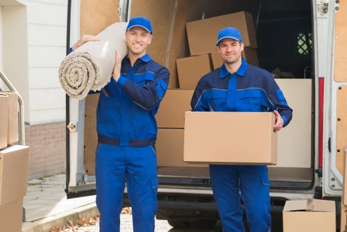 Local moving truck helping with furniture transport in Leyton