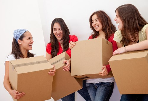 Moving team helping a Leyton household with boxes and furniture