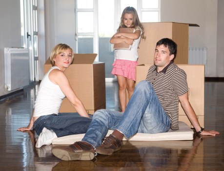 Packed boxes and furniture ready for removal in Leyton